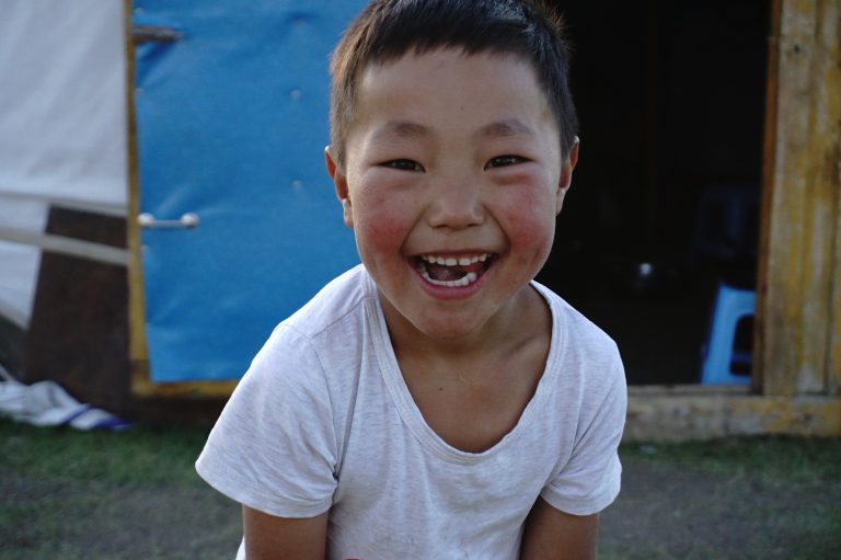 The beautiful smile of a local Mongolian boy from a herding family