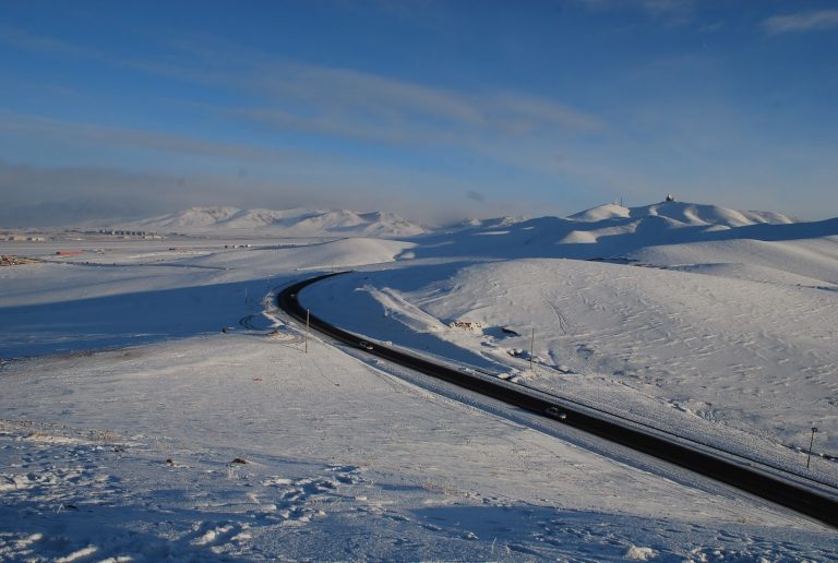 An asphalt road in Mongolia in winter