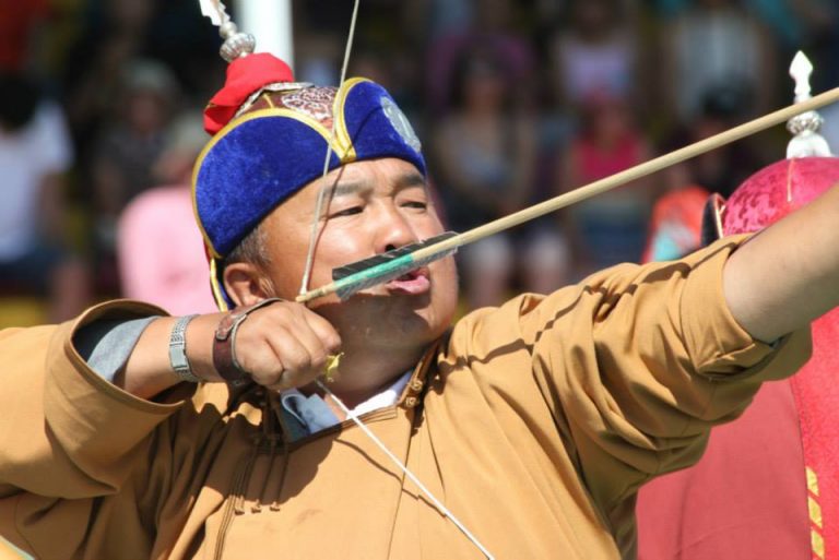 An archer taking aim at the Naadam Festival (Three Manly Sports Festival) n Ulaanbaatar, Mongolia
