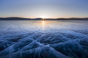 sunrise over frozen lake Khuvsgul in northern Mongolia