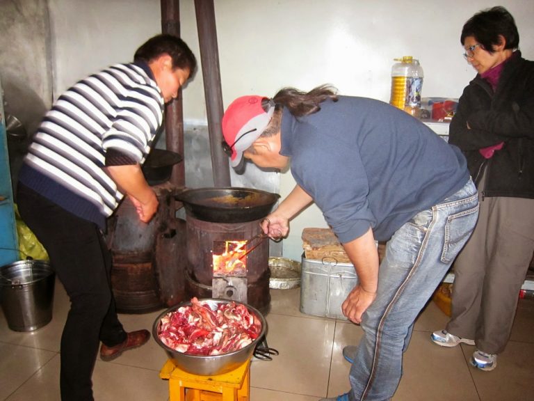 Preparing the traditional Mongolian barbecue
