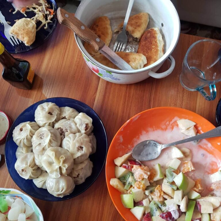 Enjoying the freshly cooked meal at our Mongolian cookery lesson