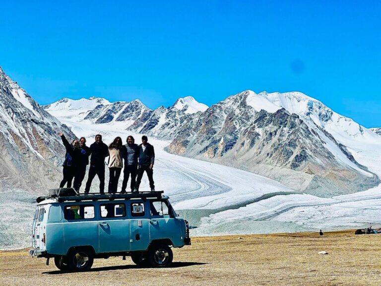 An Eternal Landscapes group with a van with a view of Altai Tavan Bogd  in Mongolia