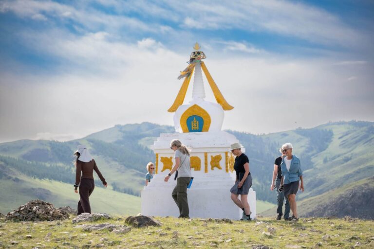 Walking around a Buddhist stupa on Eternal Landscapes Mongolia tour