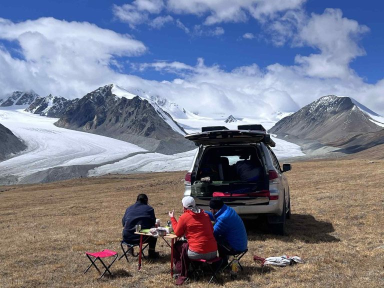 One of our tour vehicles in front of Altai Tavan Bogd Mountains